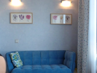 yana_lolita covering her tits with a shirt caresses her clit