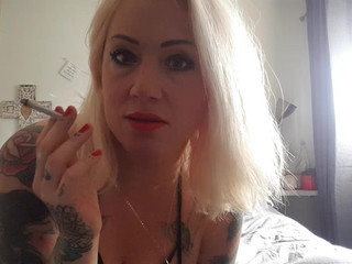 Tattooedbustymia  caresses the clitoris under the table