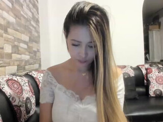 Sara fun pissing a little leaning on the back of the chair