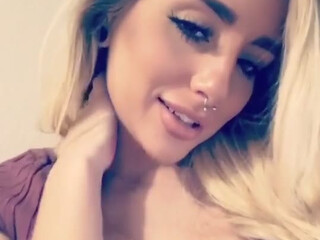 naomiwoods busty  cam girl  caresses her lips.
