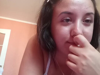 abigeil77 pissing a little leaning on the back of the chair