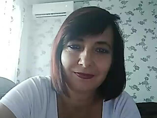 KoshkaKissES shows her pussy on the chair