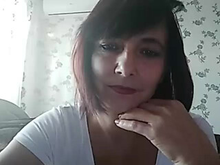 KoshkaKissES jerking off the clit on the bed