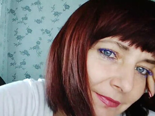 KoshkaKissES redhead female caresses big tits