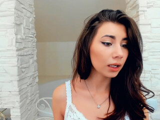 ArielBloom webcam show busty chick caresses shaved foil