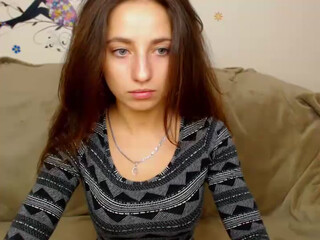 Beauty Adele webcam show awesome brown girl in white stockings tickles her cap delicately