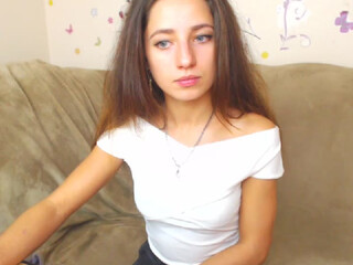 Beauty Adele webcam show curve with a hanging chest caresses the vagina