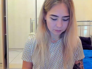 Escasa  webcam show charming babe poses nude in front of the webcam