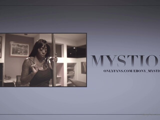 ebony mystique caresses the clitoris under the table