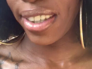 ebony mystique girl with a beautiful body performs a striptease