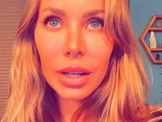 xnicoleanistonx dancing near the christmas tree