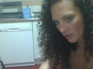 milflucy mature slut pulls pussy while lying in a chair