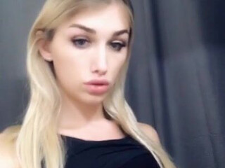 Luna Love busty young lady erotically posing in a dress