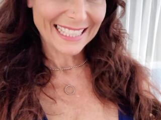 Syren De Mer redhead female caresses big tits