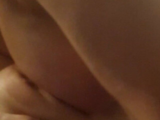 Busty Klara in black stockings jerks off