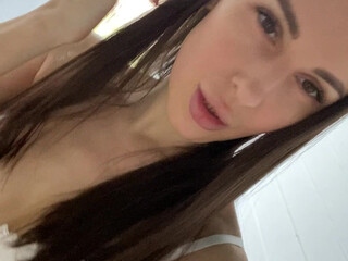 Lilu Moon naughty female caresses shaved cunt