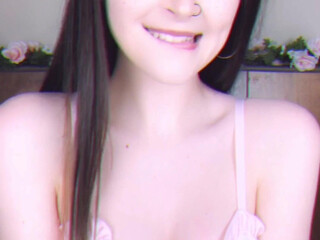 DolliDoll petite slut masturbates with her fingers