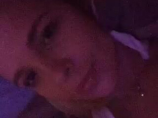 Katerina Lynx  Busty chick caresses shaved pussy