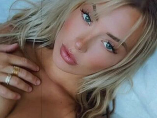 Corinna Kopf aka corinnakopf onlyfans Graceful female admires beautiful tits